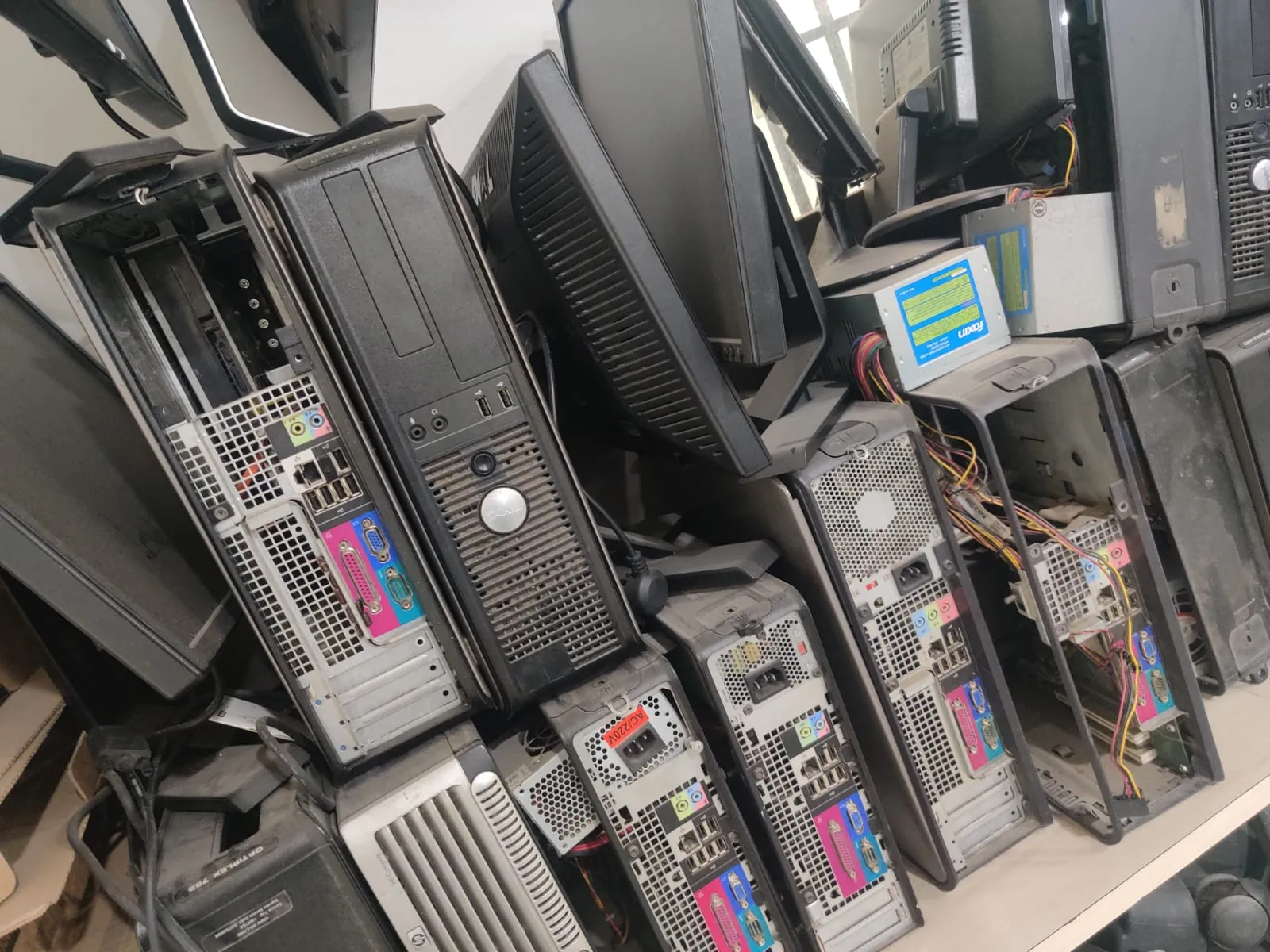 Dell Optiplex desktops and monitors stacked together